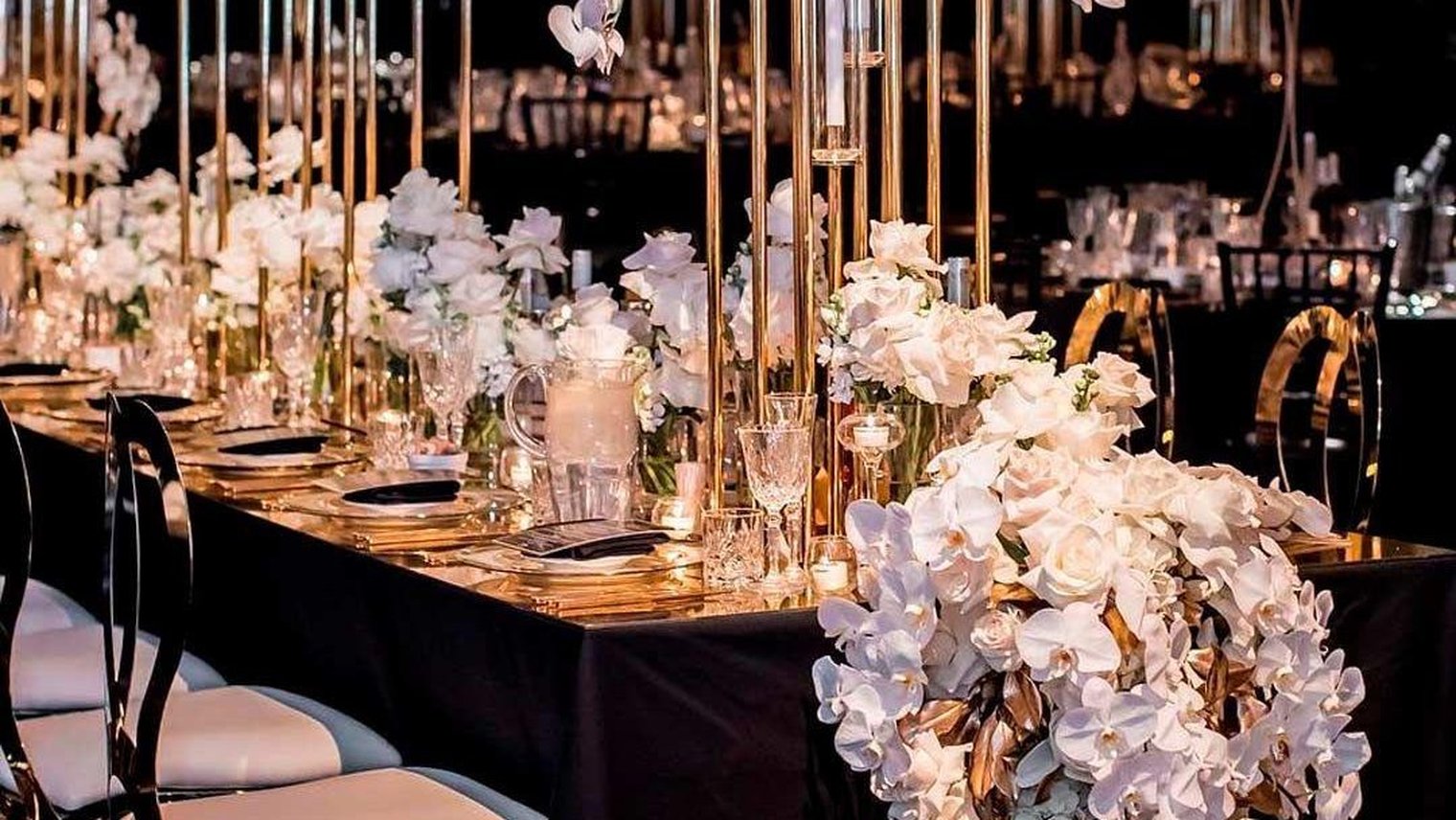 Candlelit banquet hall set for a private celebration