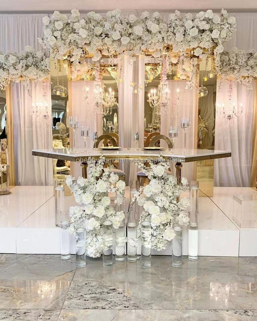 White floral canopy staged over a mirrored sweetheart table
